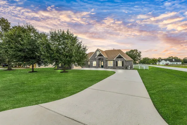 a dining room with furniture a chandelier and a rug