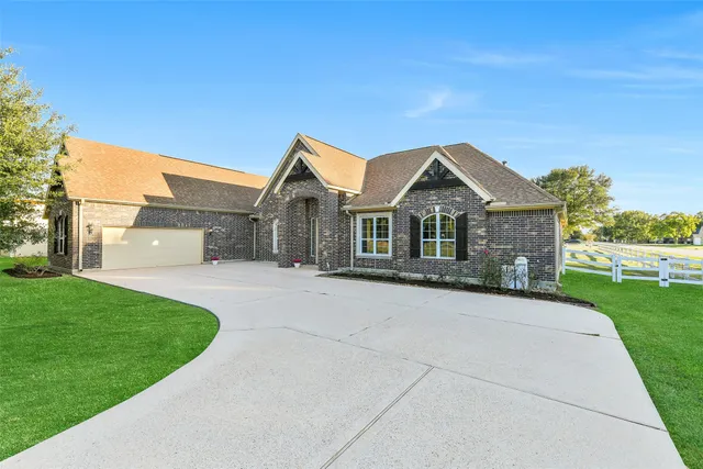 a view of a dining room with furniture and a chandelier