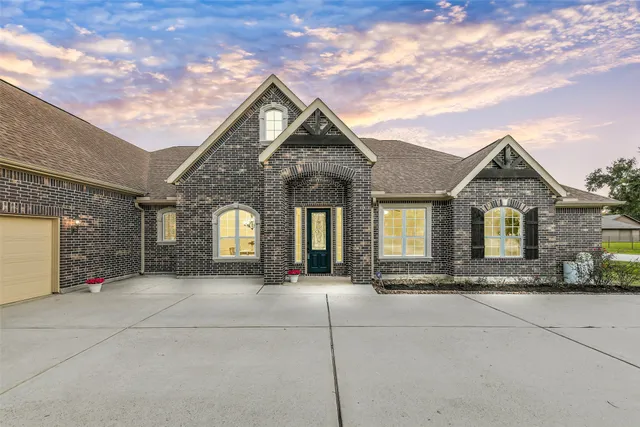 a bathroom with a tub a sink and mirrors