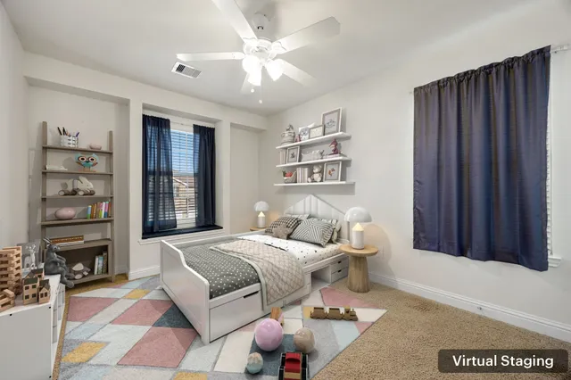 a bedroom with a bed furniture and window