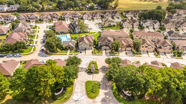 an aerial view of residential houses with outdoor space