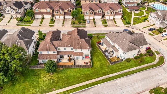 a view of a swimming pool with a table and chairs