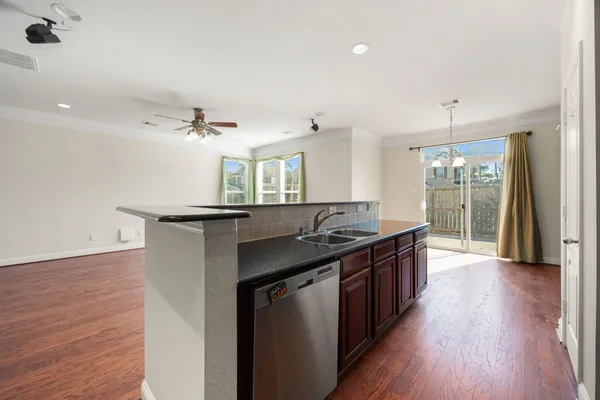 a kitchen with stainless steel appliances granite countertop a stove and a sink