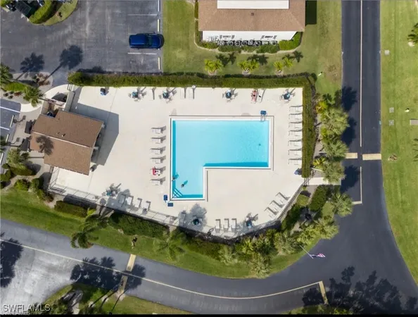 a view of swimming pool with a yard and outdoor seating