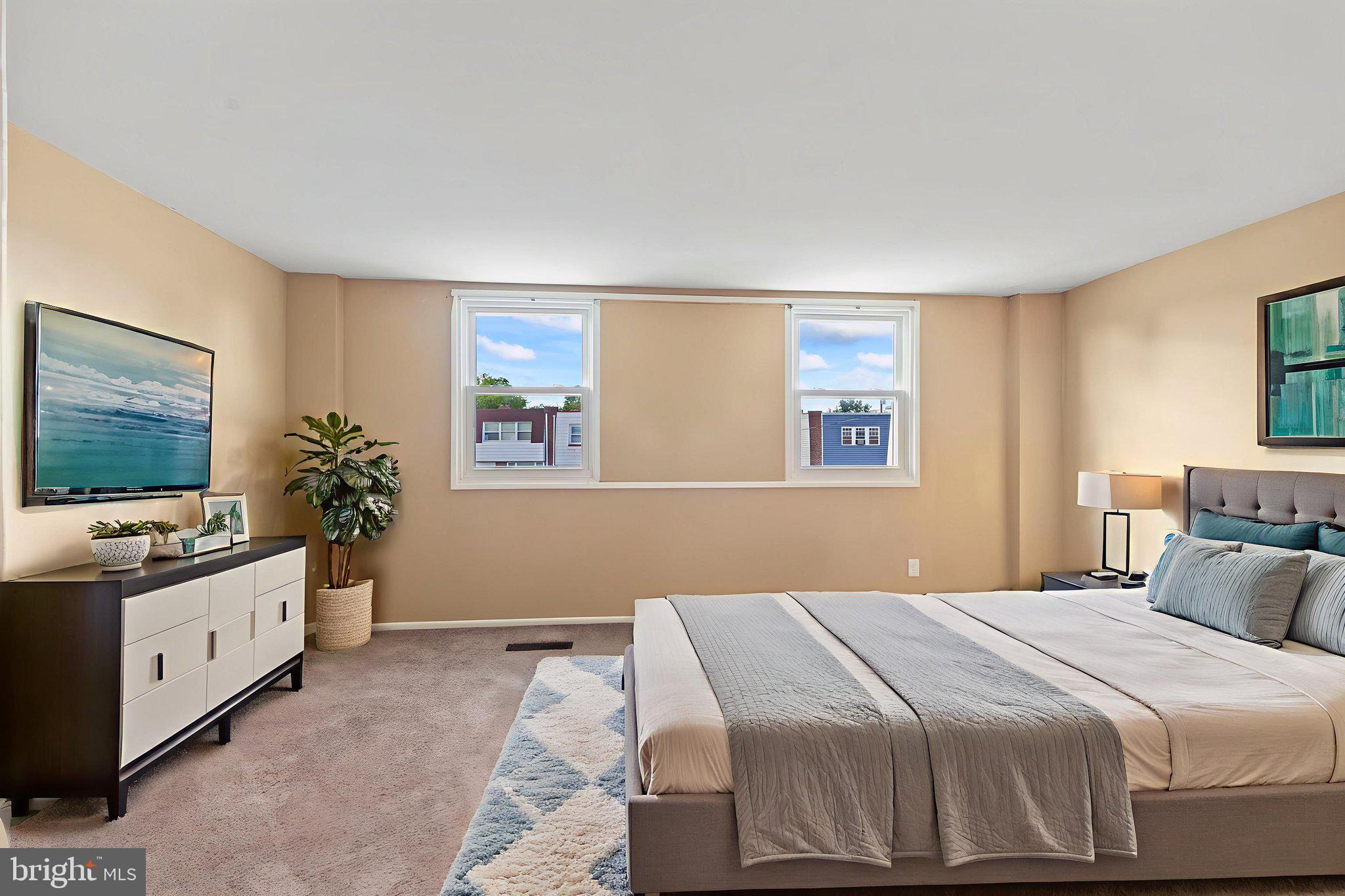 4274 Lawnside Road Philadelphia, PA 19154 - Photo 13 of 20 a bedroom with a bed and a flat screen tv