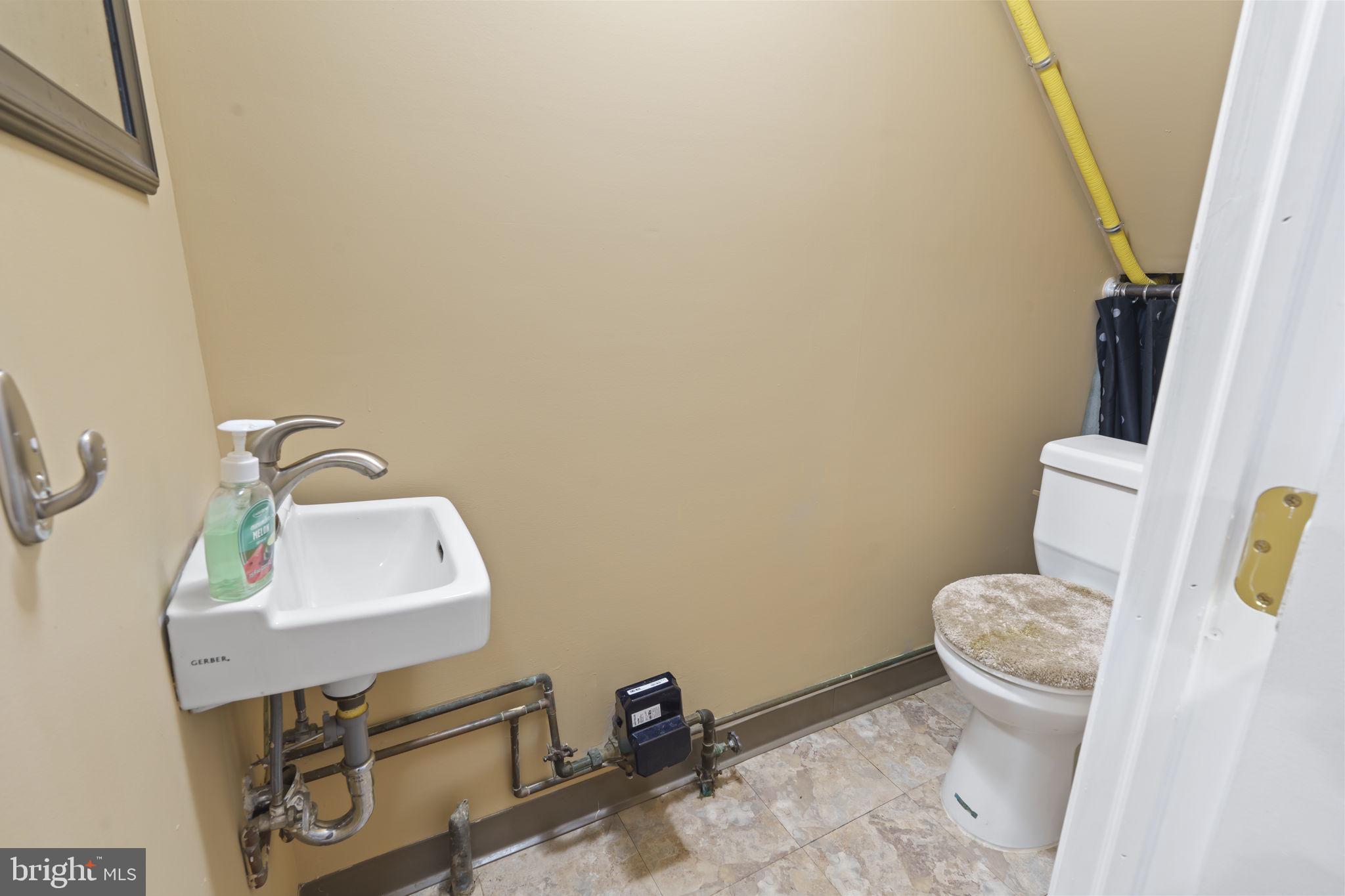 4274 Lawnside Road Philadelphia, PA 19154 - Photo 18 of 20 a bathroom with a toilet and a sink