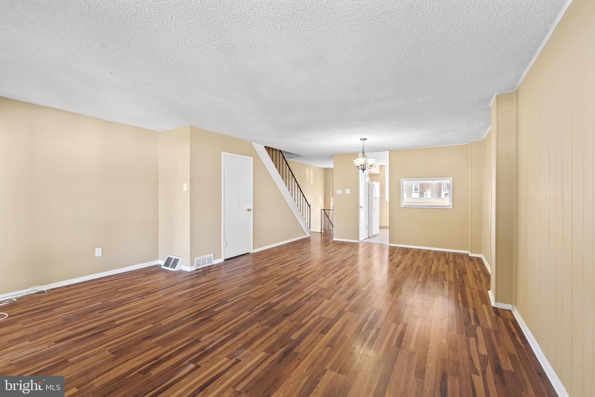 4274 Lawnside Road Philadelphia, PA 19154 - Photo 4 of 20 a view of an empty room with wooden floor and a window