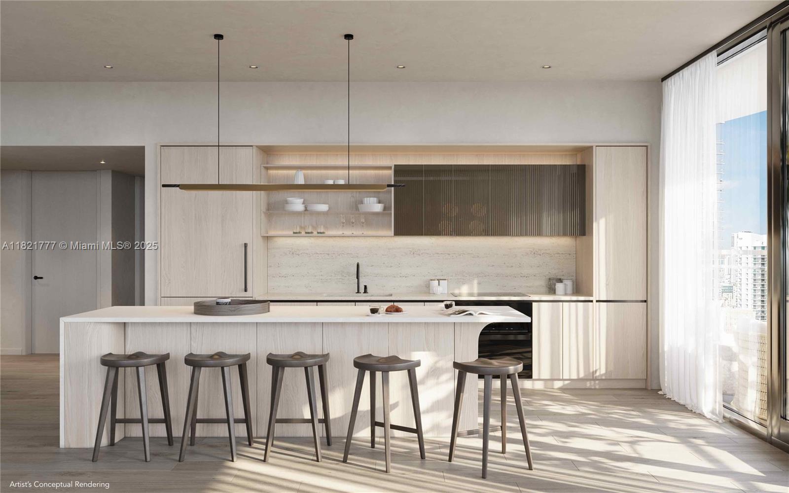 99 Southwest 7th Street, Unit PH3904 Miami, FL 33130 - Photo 2 of 10 a kitchen with kitchen island white cabinets and stainless steel appliances