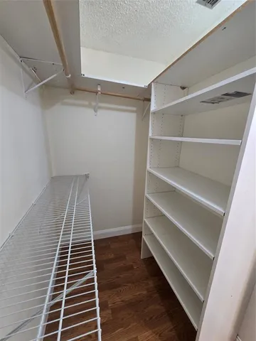 a view of an empty walk in closet