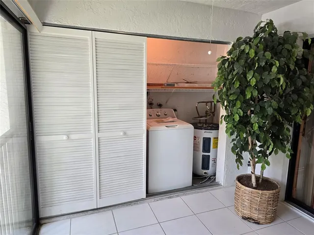 a utility room with closet and utility room