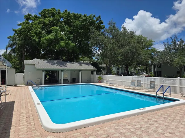 a view of a house with swimming pool