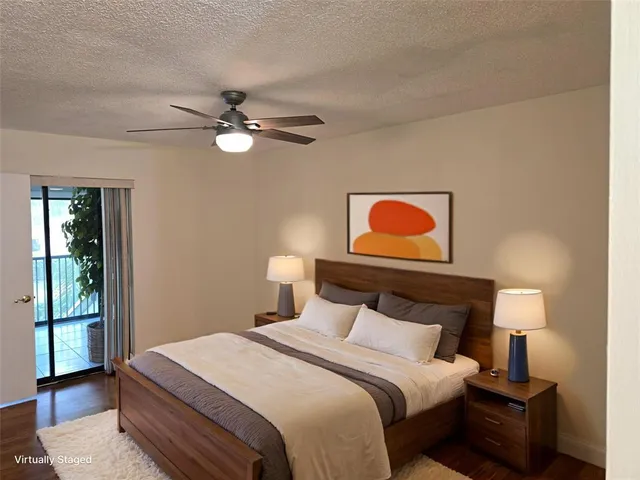 a bedroom with a bed and a lamp