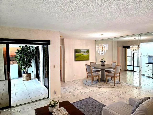 a view of a livingroom with furniture window and wooden floor