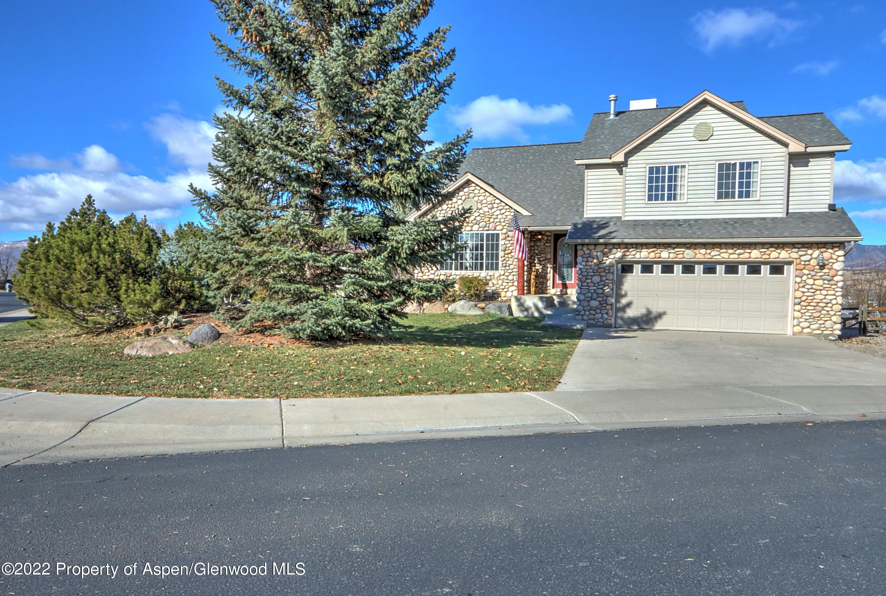 1220 Sage Court Rifle, CO 81650 - Photo 1 of 41 a front view of a house with a yard