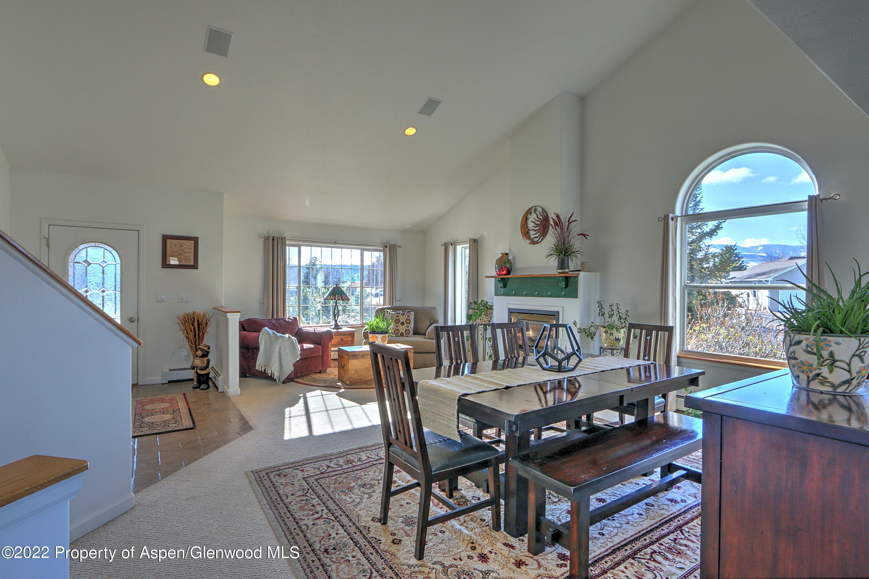 1220 Sage Court Rifle, CO 81650 - Photo 12 of 41 a living room with furniture a window and a table