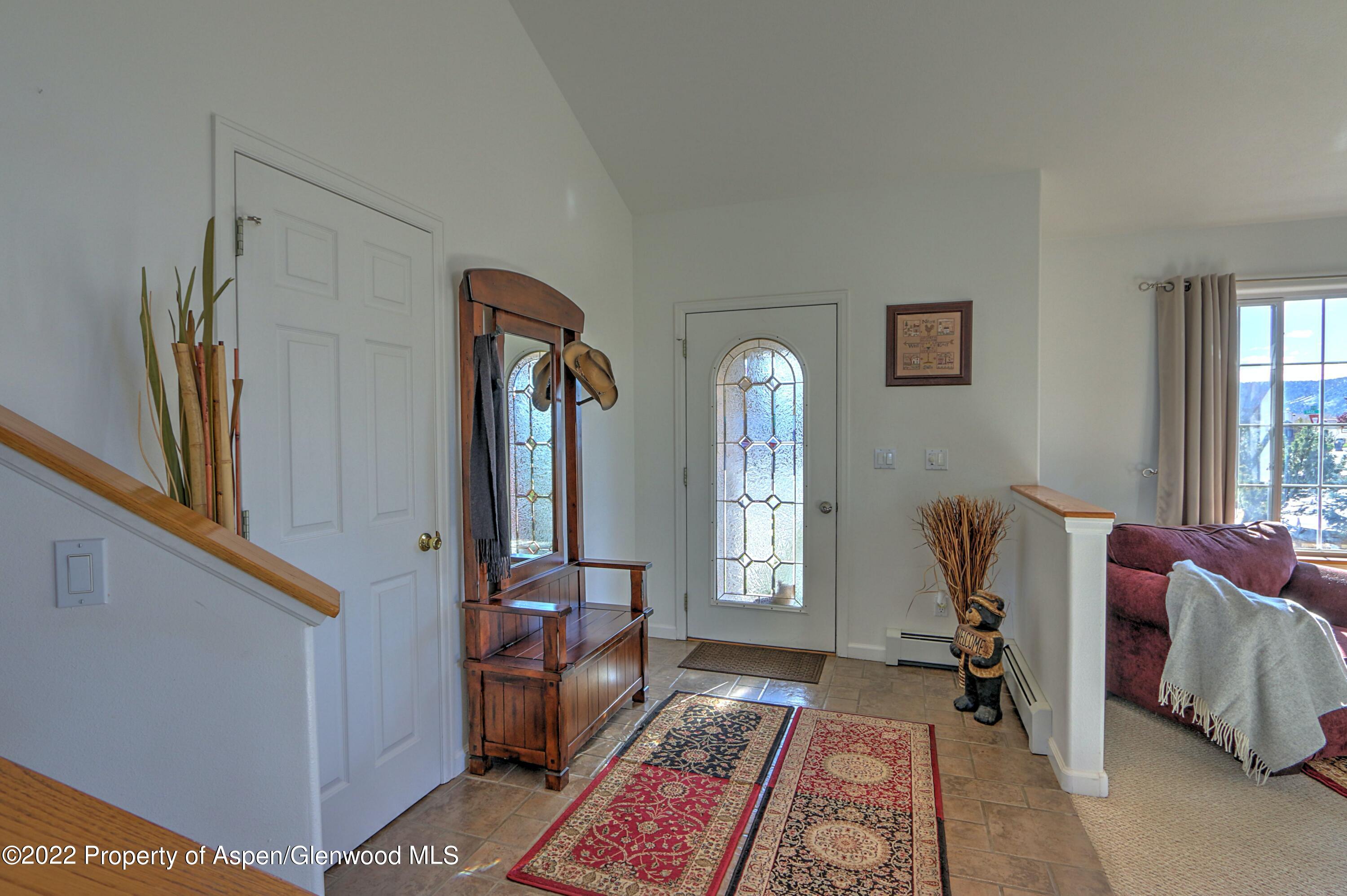1220 Sage Court Rifle, CO 81650 - Photo 20 of 41 a living room with furniture and a window