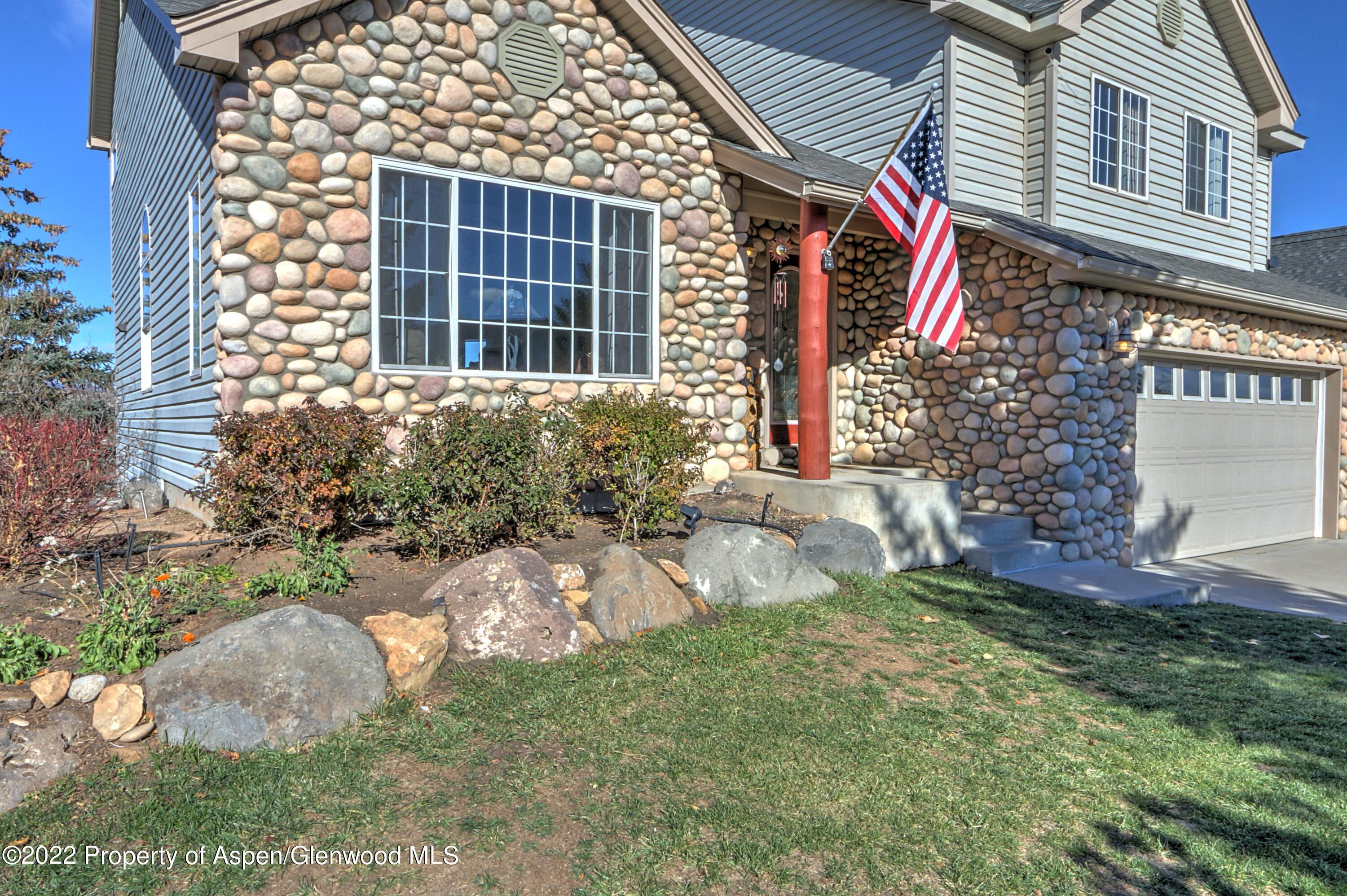 1220 Sage Court Rifle, CO 81650 - Photo 2 of 41 front view of a house with a yard