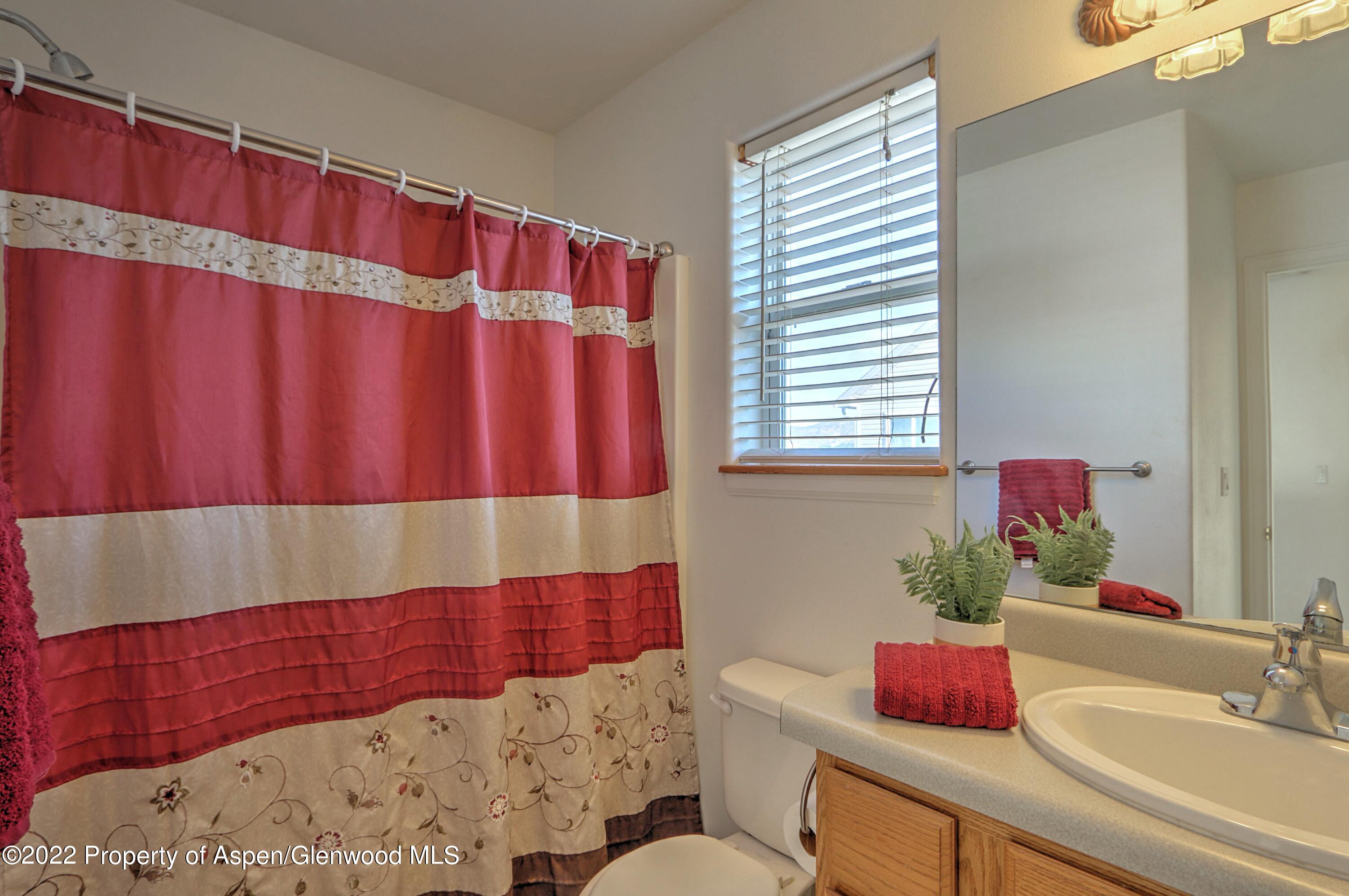 1220 Sage Court Rifle, CO 81650 - Photo 28 of 41 a bathroom with a sink and a mirror