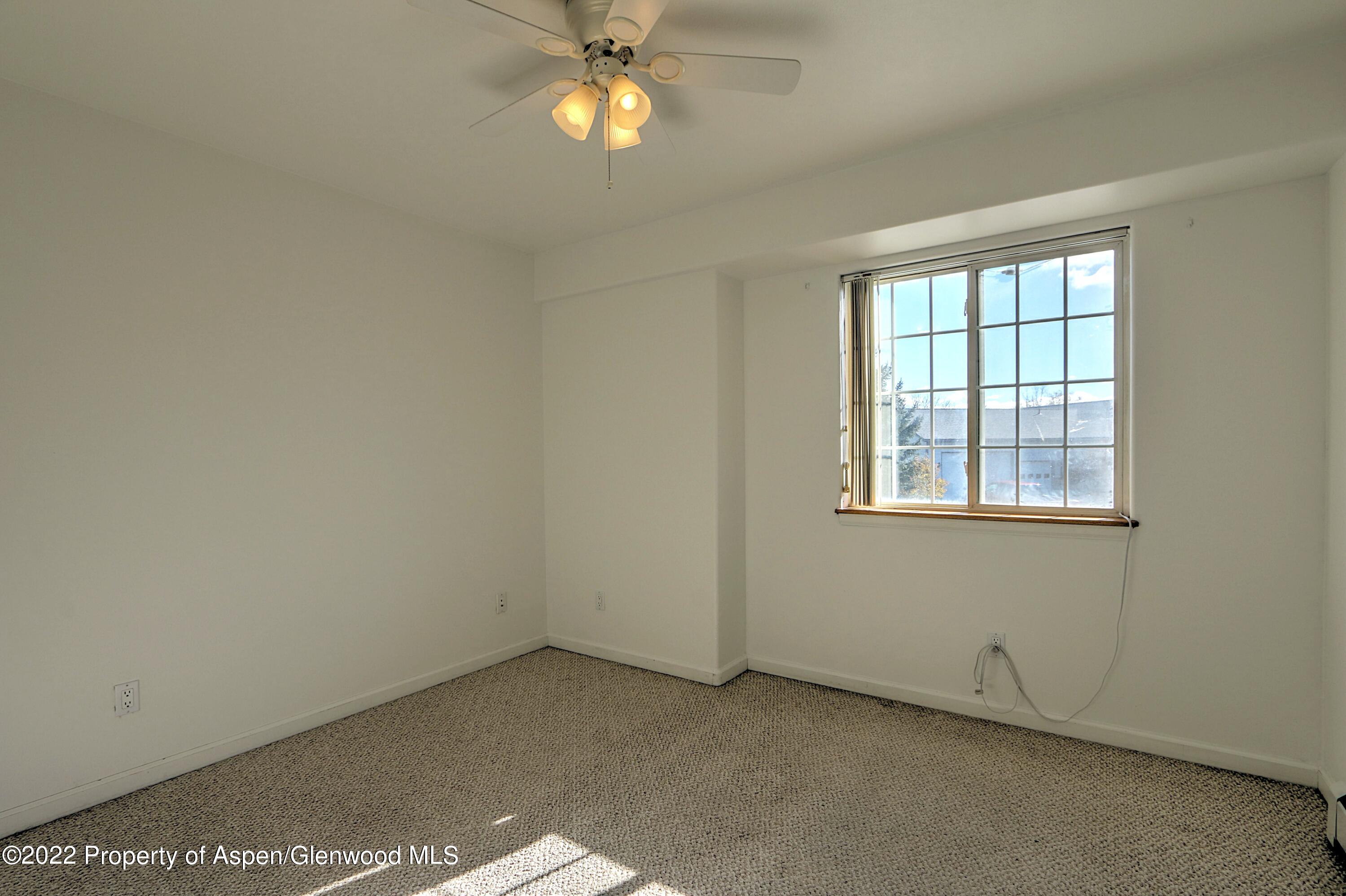 1220 Sage Court Rifle, CO 81650 - Photo 29 of 41 an empty room with a window