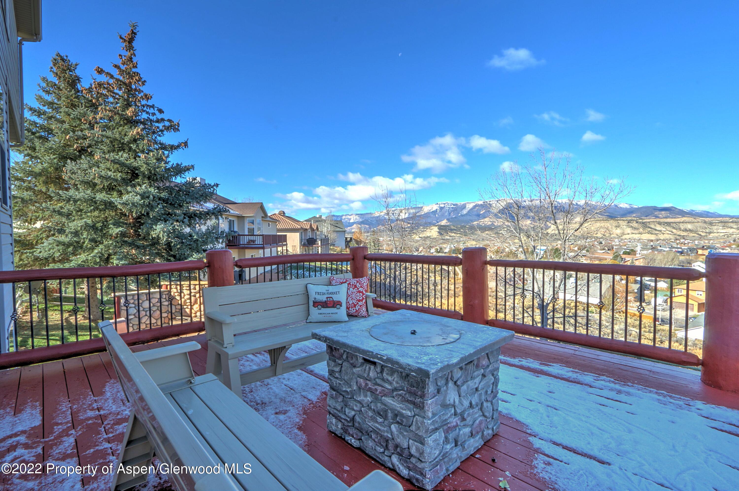 1220 Sage Court Rifle, CO 81650 - Photo 4 of 41 a view of a balcony with wooden chairs