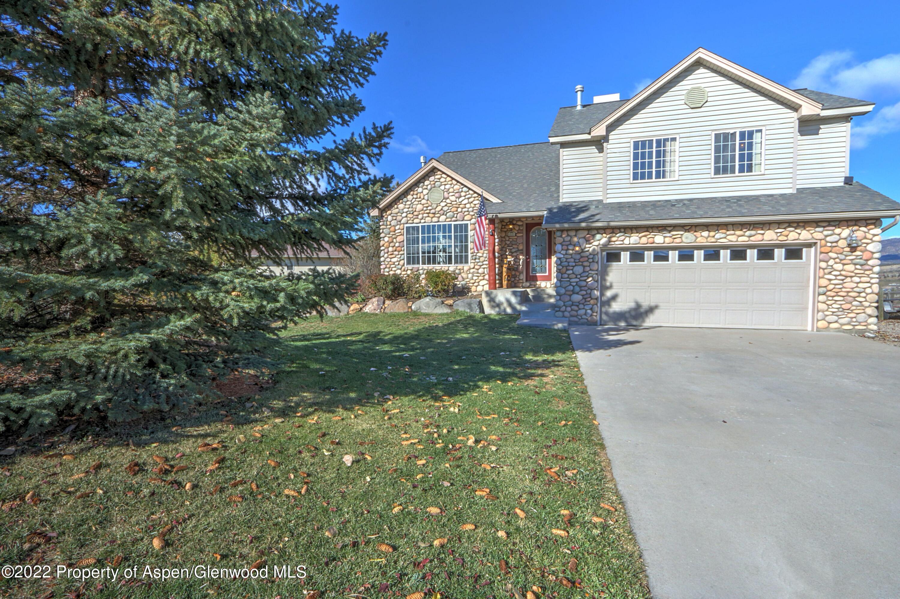 1220 Sage Court Rifle, CO 81650 - Photo 41 of 41 a view of a house with a yard