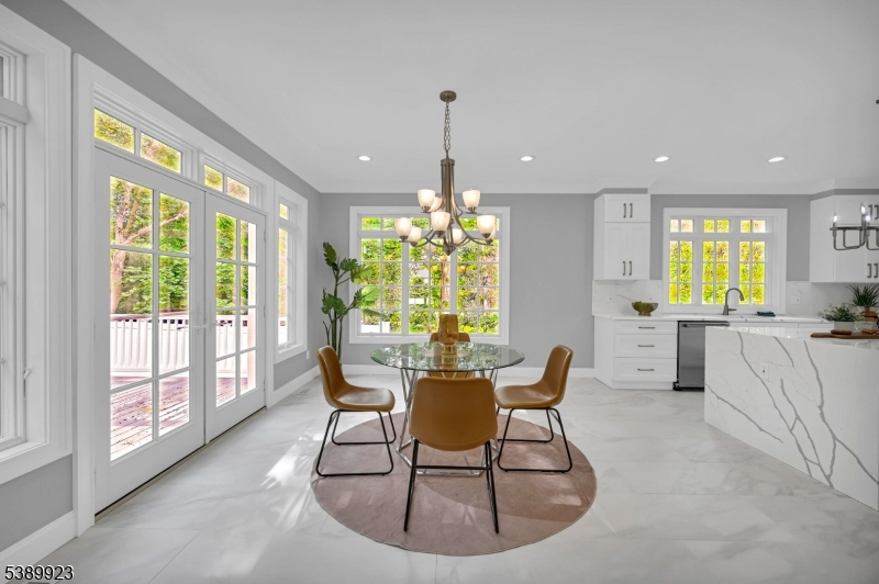 466 White Oak Ridge Road Short Hills, NJ 07078 - Photo 14 of 49 a dining room with furniture a chandelier and wooden floor