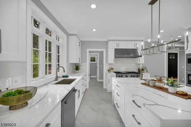 a kitchen with a sink stove and cabinets