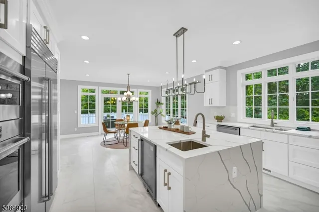 a kitchen with a sink stove and refrigerator