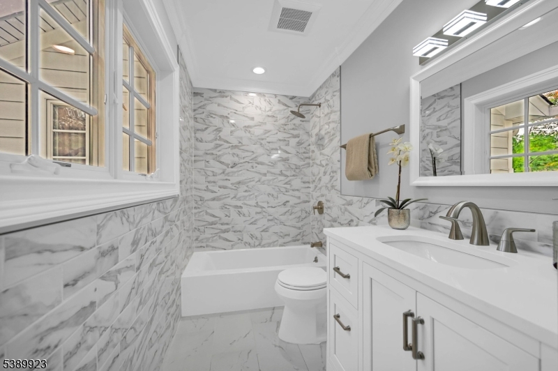 466 White Oak Ridge Road Short Hills, NJ 07078 - Photo 30 of 49 a bathroom with a bathtub shower sink vanity mirror and toilet