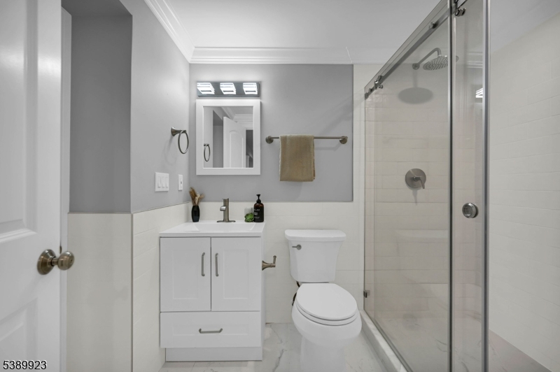 466 White Oak Ridge Road Short Hills, NJ 07078 - Photo 39 of 49 a bathroom with a sink a toilet and shower