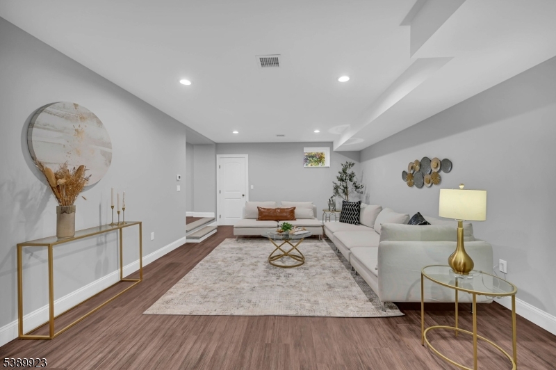 466 White Oak Ridge Road Short Hills, NJ 07078 - Photo 41 of 49 a living room with furniture and a wooden floor