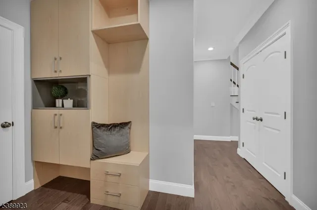 a view of an house with backyard and a tree