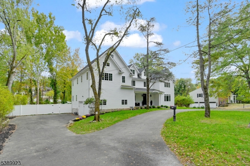 466 White Oak Ridge Road Short Hills, NJ 07078 - Photo 47 of 49 a front view of a house with a yard and tree
