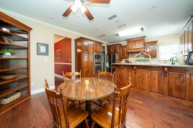 a dining room with furniture and window