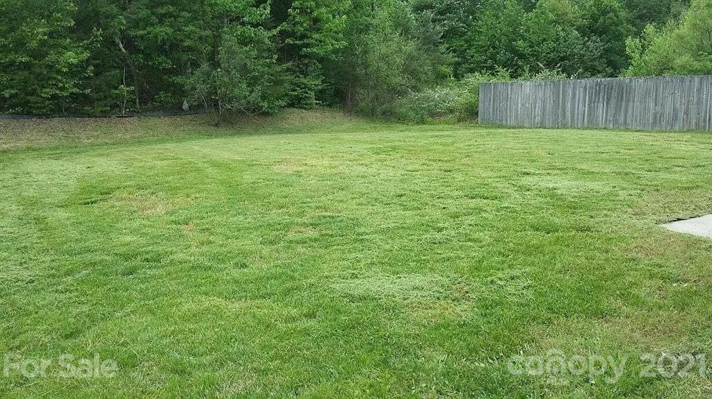 1203 Helms Road Charlotte, NC 28214 - Photo 2 of 5 a view of outdoor space with deck and yard