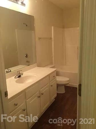 1203 Helms Road Charlotte, NC 28214 - Photo 3 of 5 a bathroom with a sink and a toilet