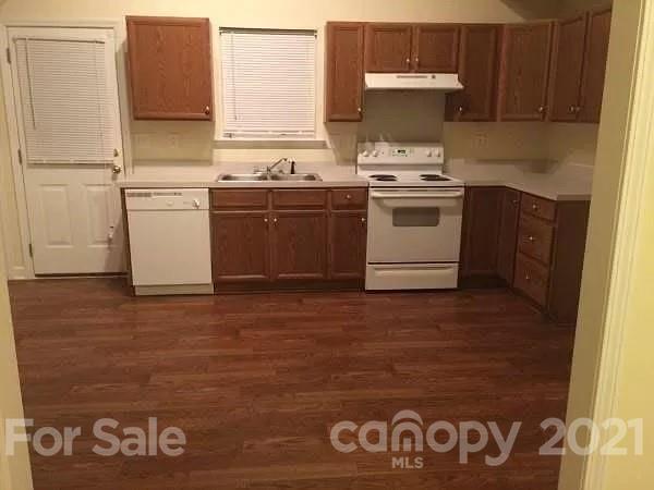 1203 Helms Road Charlotte, NC 28214 - Photo 5 of 5 a kitchen with a stove top oven and sink