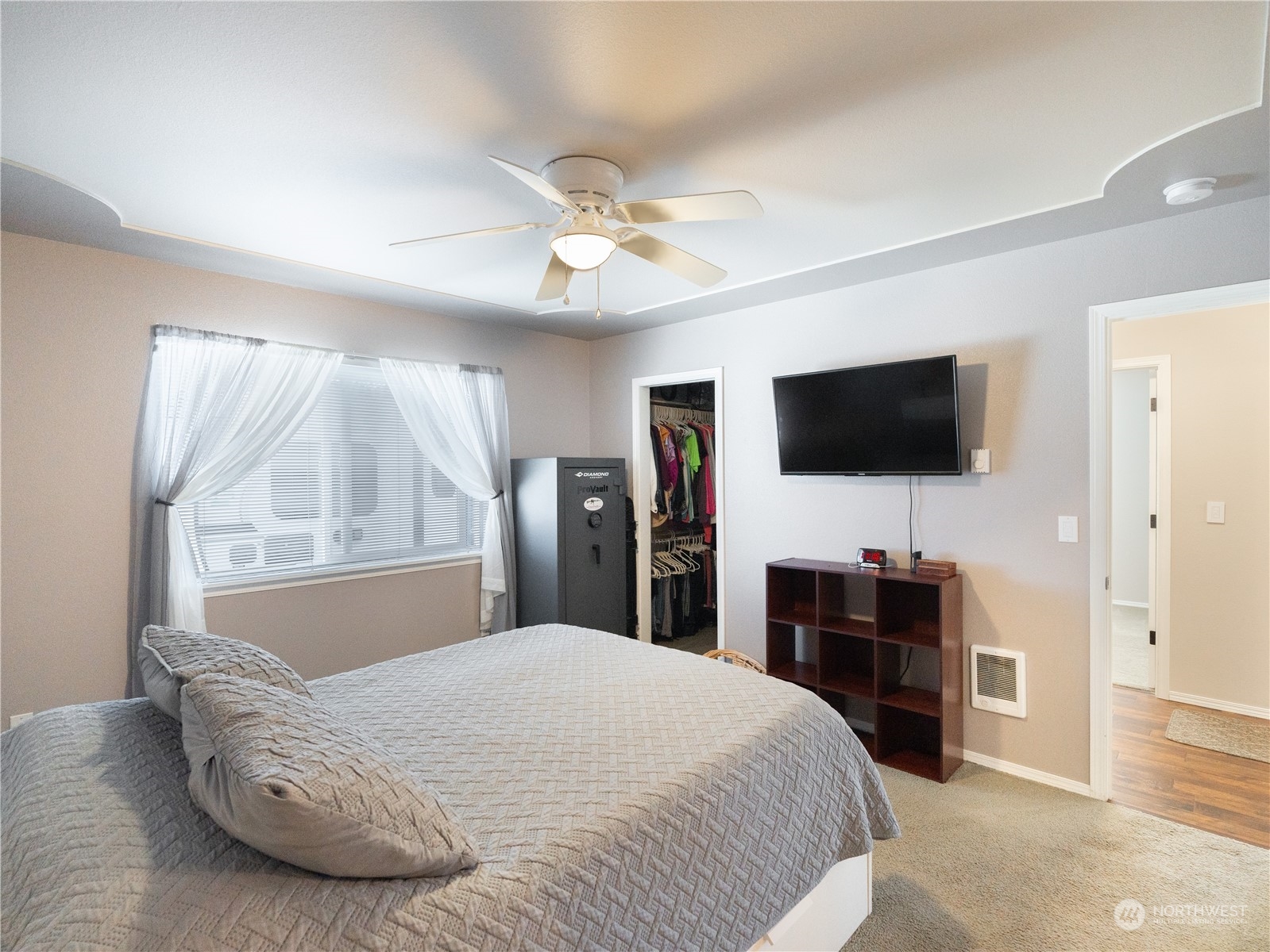 18940 Melon Street Southwest Rochester, WA 98579 - Photo 13 of 39 a bedroom with a bed and a flat screen tv