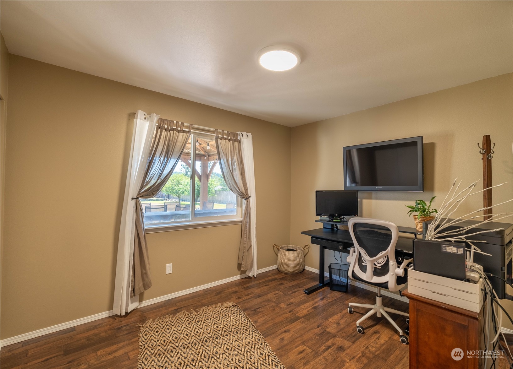 18940 Melon Street Southwest Rochester, WA 98579 - Photo 16 of 39 a view of a workspace with furniture and a window