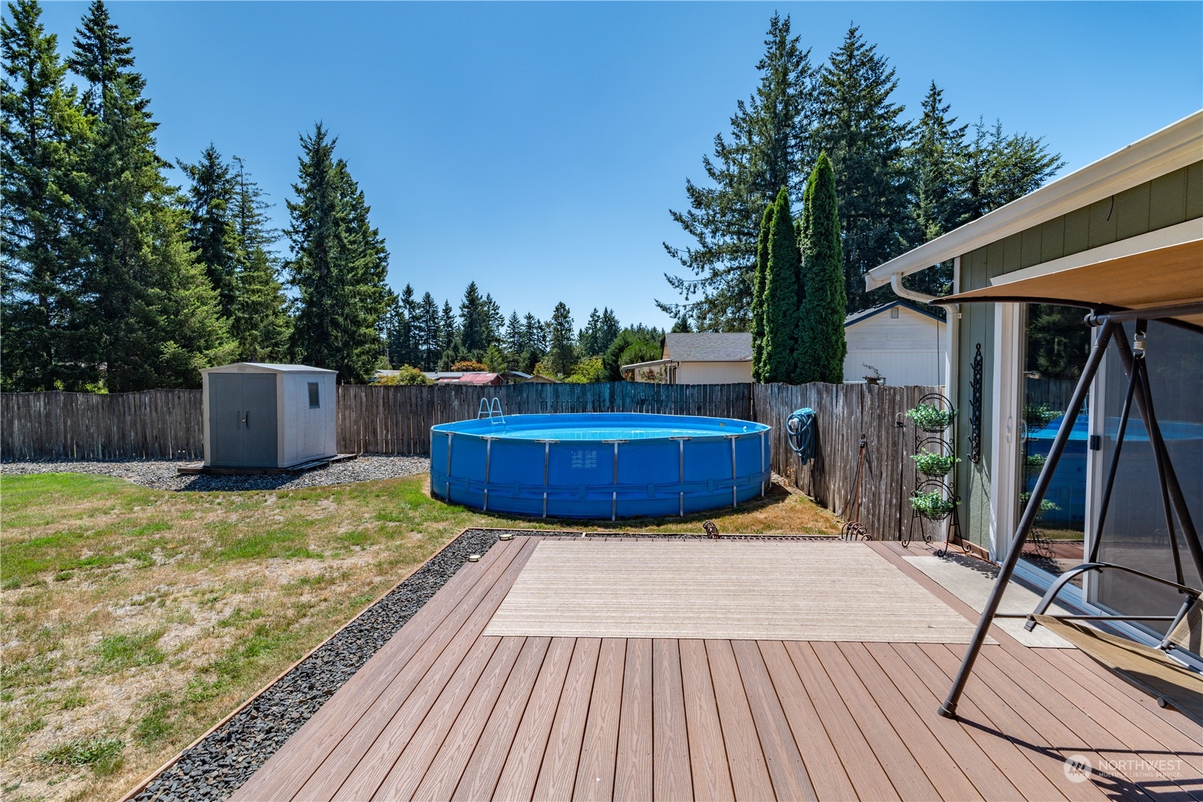 18940 Melon Street Southwest Rochester, WA 98579 - Photo 20 of 39 a view of a backyard with wooden floor and roof
