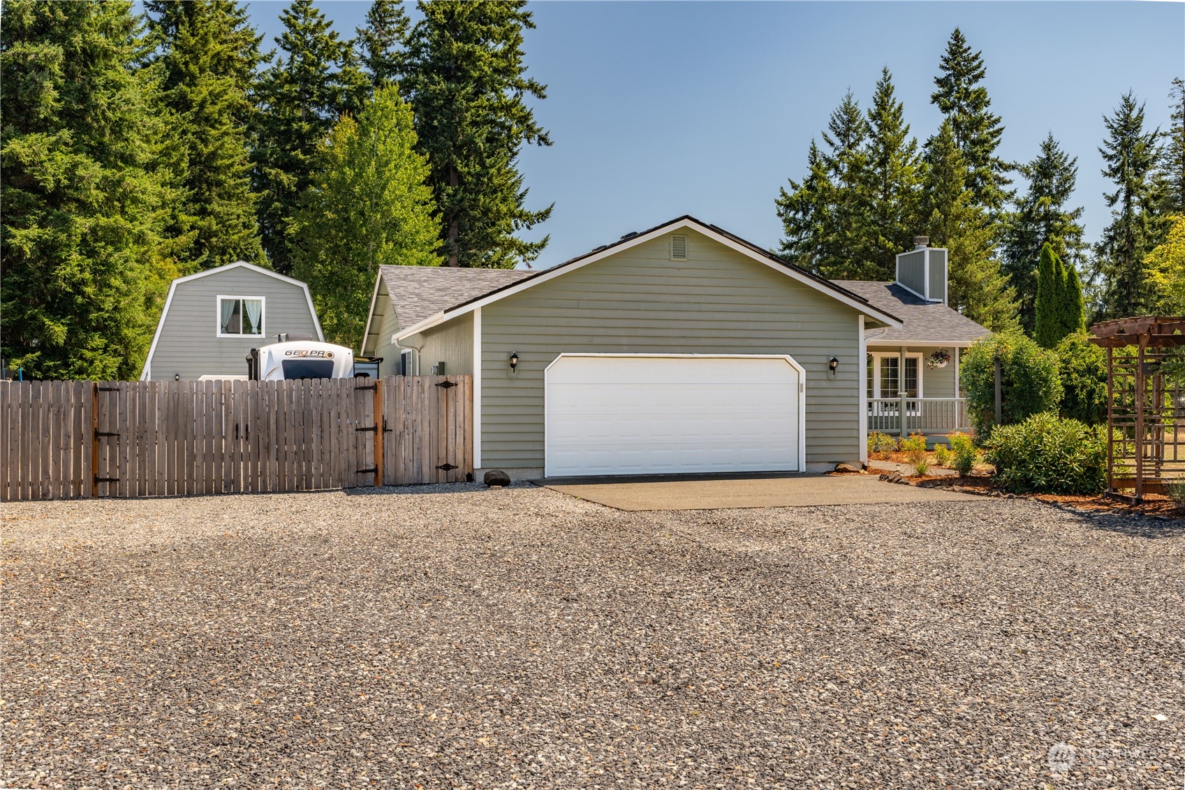 18940 Melon Street Southwest Rochester, WA 98579 - Photo 2 of 39 a front view of a house with a yard and garage