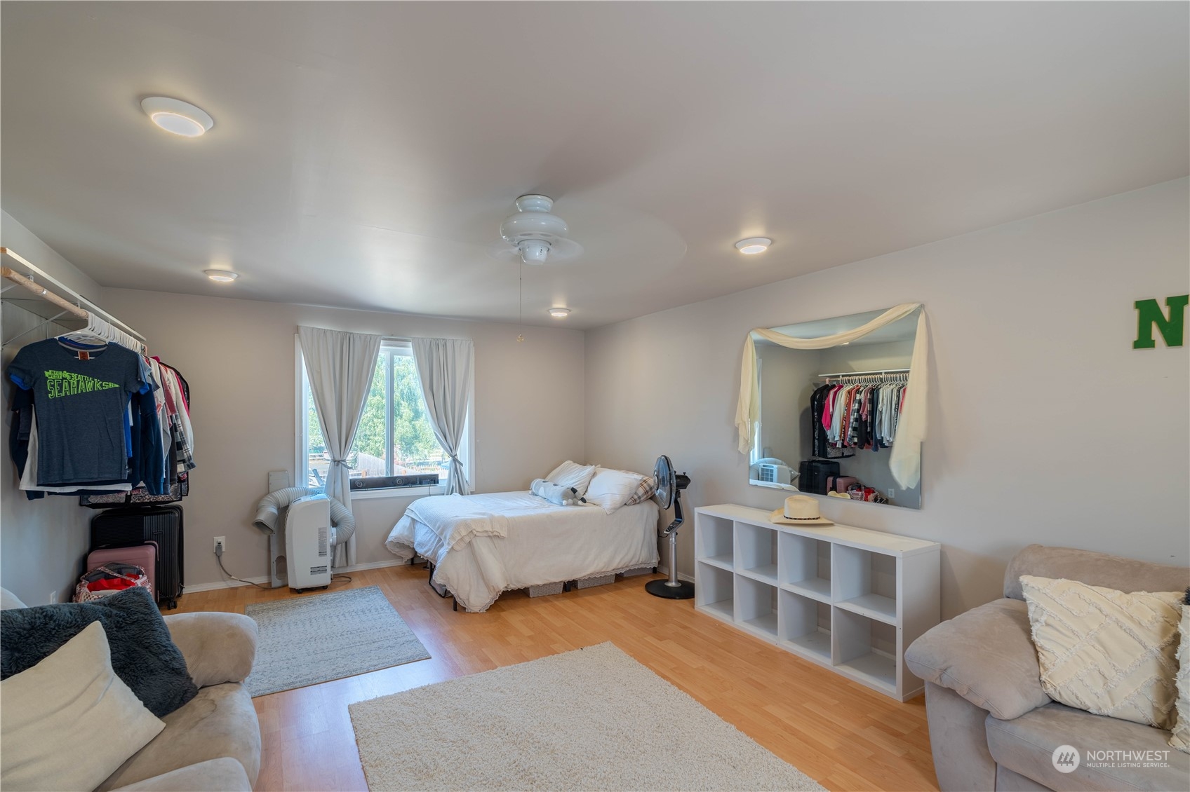 18940 Melon Street Southwest Rochester, WA 98579 - Photo 27 of 39 a bedroom with furniture and a flat screen tv