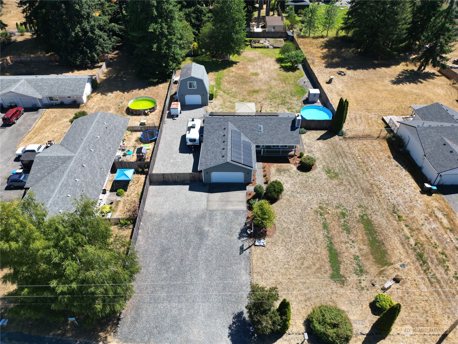 18940 Melon Street Southwest Rochester, WA 98579 - Photo 3 of 39 an aerial view of a house with a swimming pool