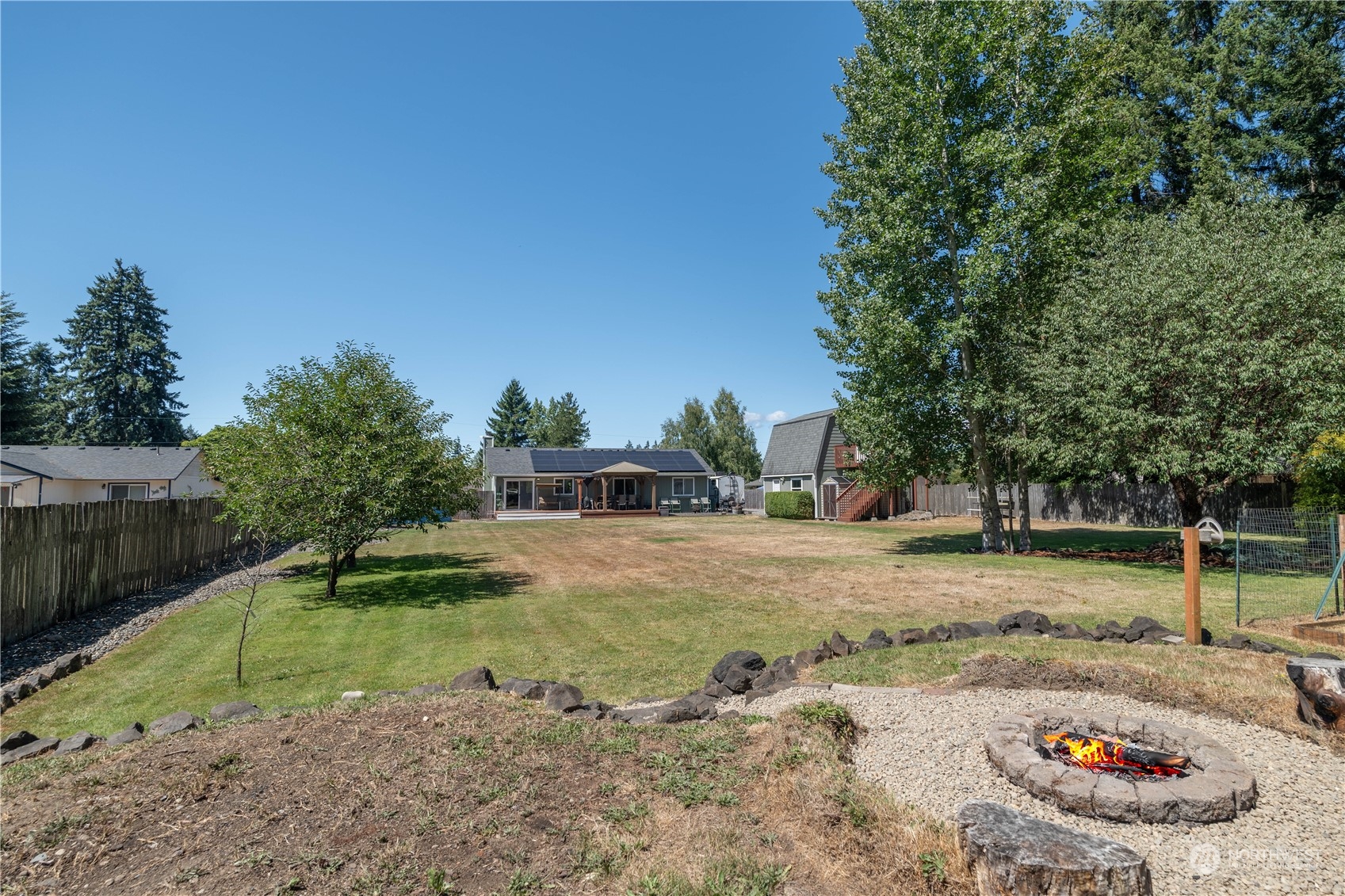 18940 Melon Street Southwest Rochester, WA 98579 - Photo 31 of 39 a view of a backyard with a trampoline