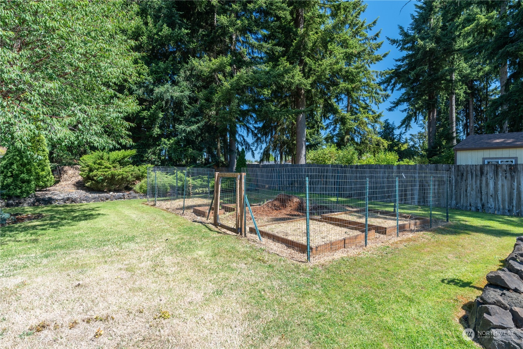 18940 Melon Street Southwest Rochester, WA 98579 - Photo 33 of 39 a view of a backyard with a slide