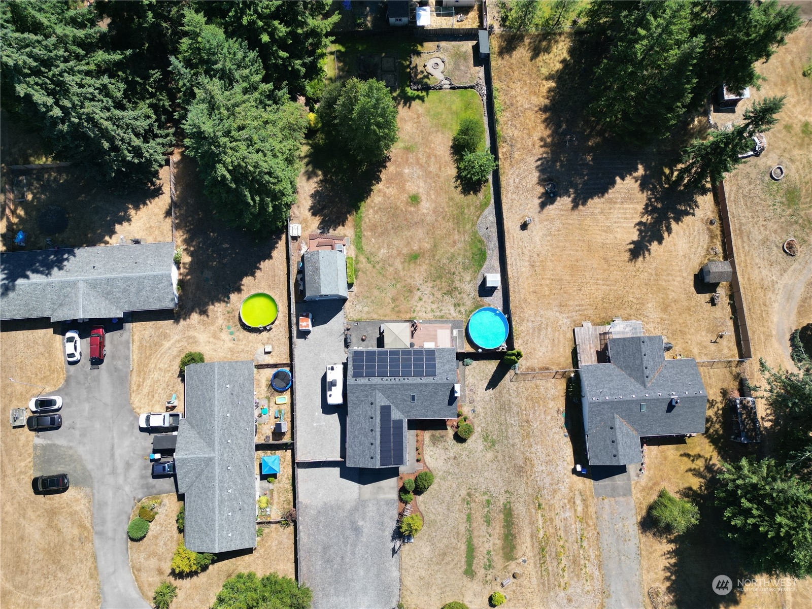 18940 Melon Street Southwest Rochester, WA 98579 - Photo 36 of 39 aerial view of a house with a swimming pool and outdoor seating