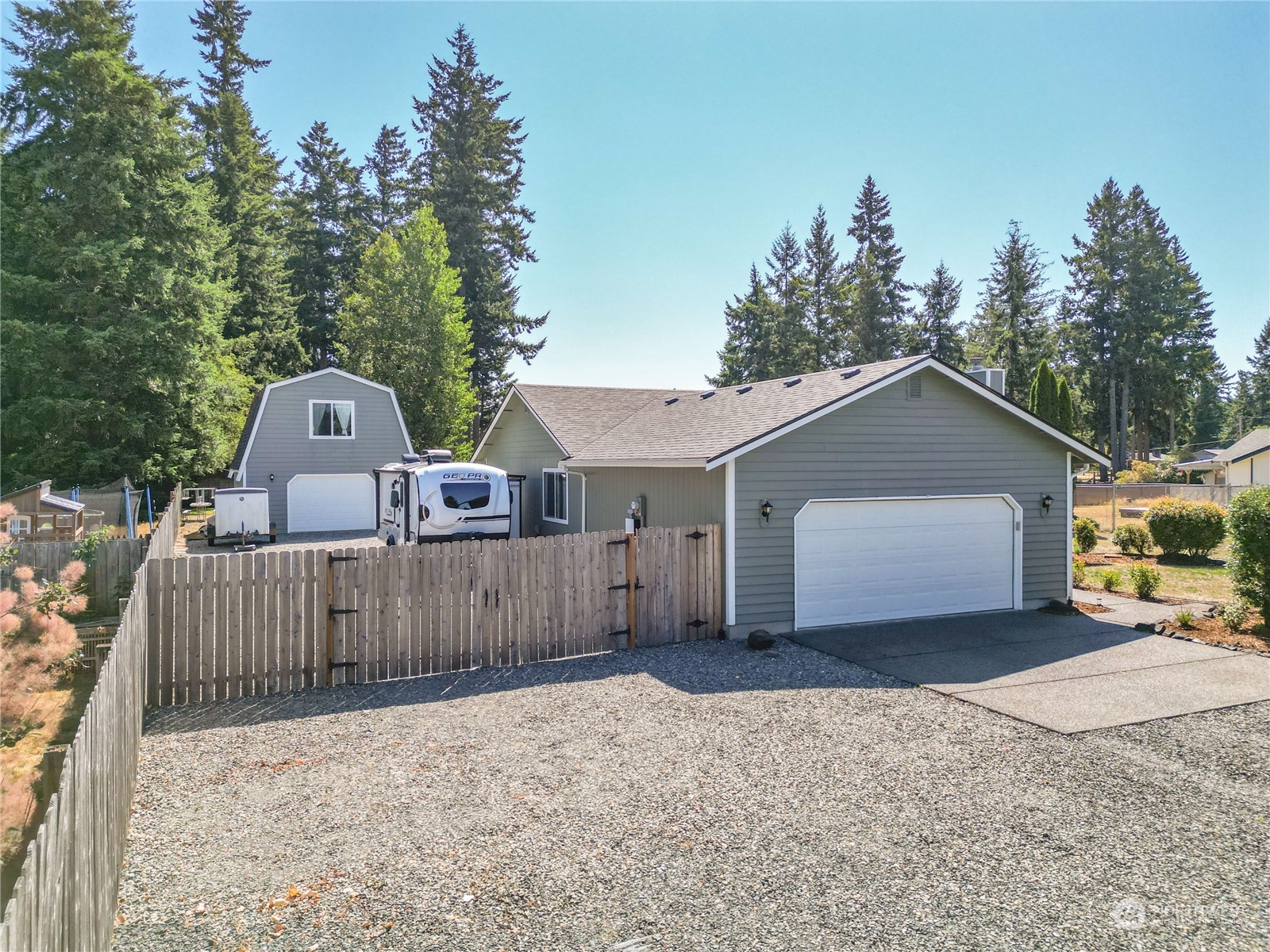 18940 Melon Street Southwest Rochester, WA 98579 - Photo 38 of 39 a front view of a house with a yard and garage