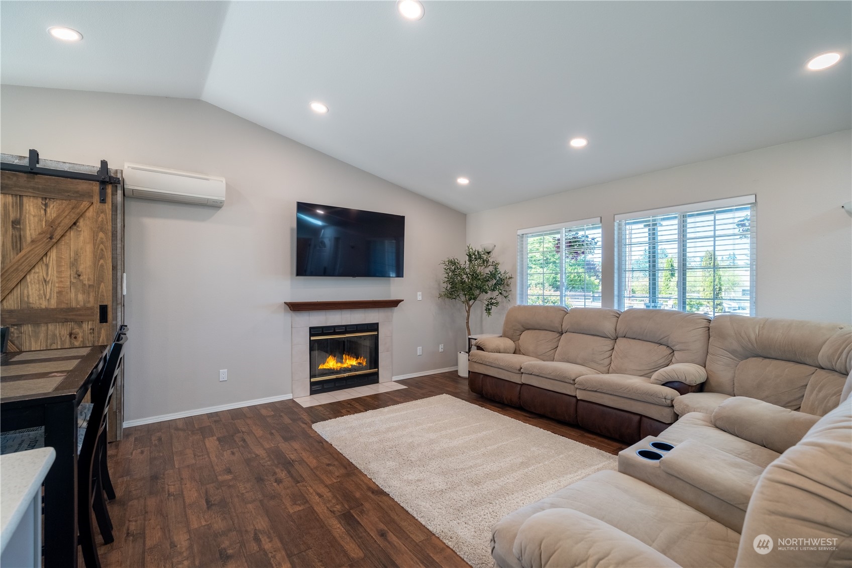 18940 Melon Street Southwest Rochester, WA 98579 - Photo 4 of 39 a living room with furniture and a fireplace