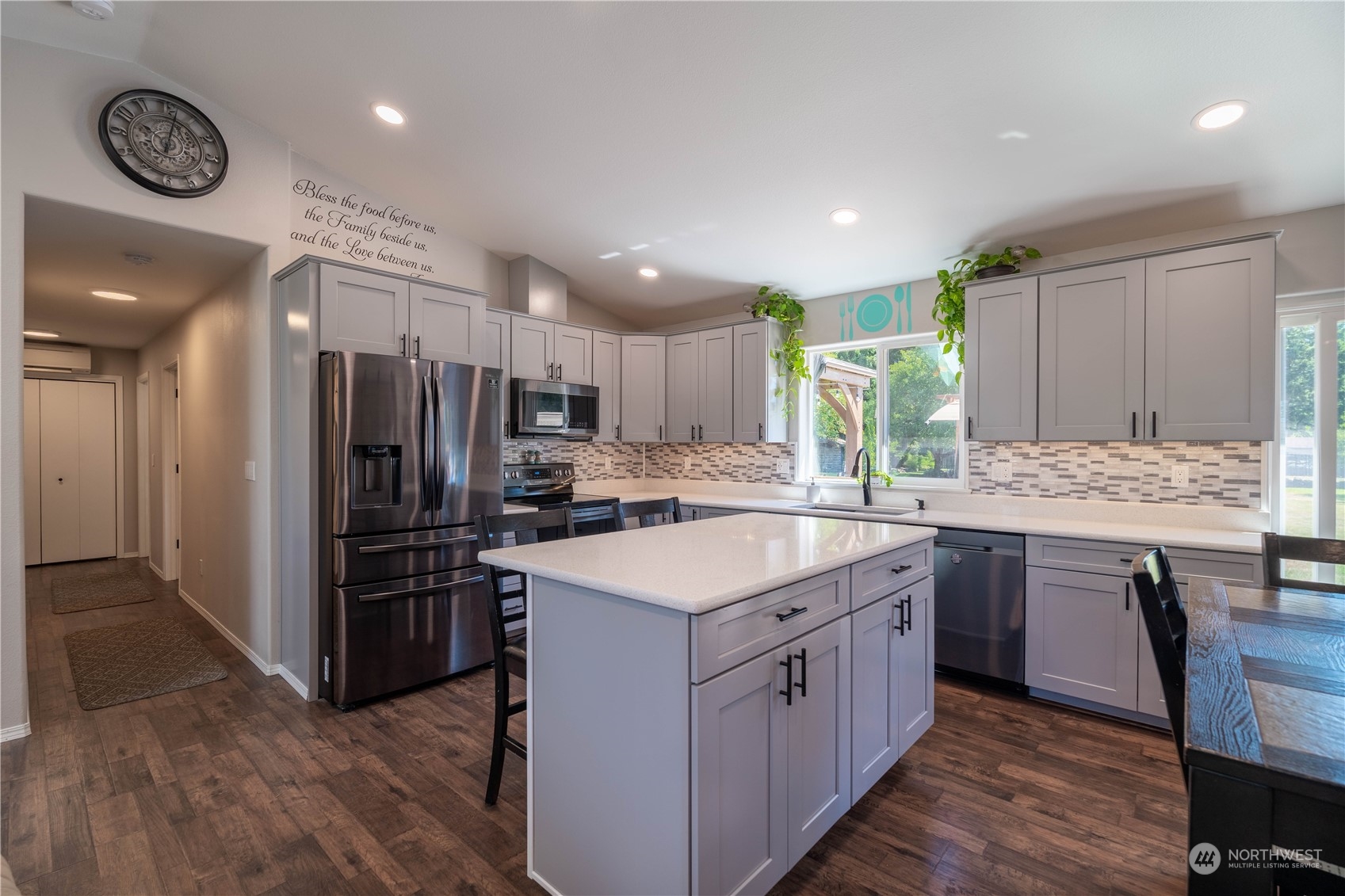 18940 Melon Street Southwest Rochester, WA 98579 - Photo 10 of 39 a kitchen with stainless steel appliances granite countertop a sink stove and refrigerator
