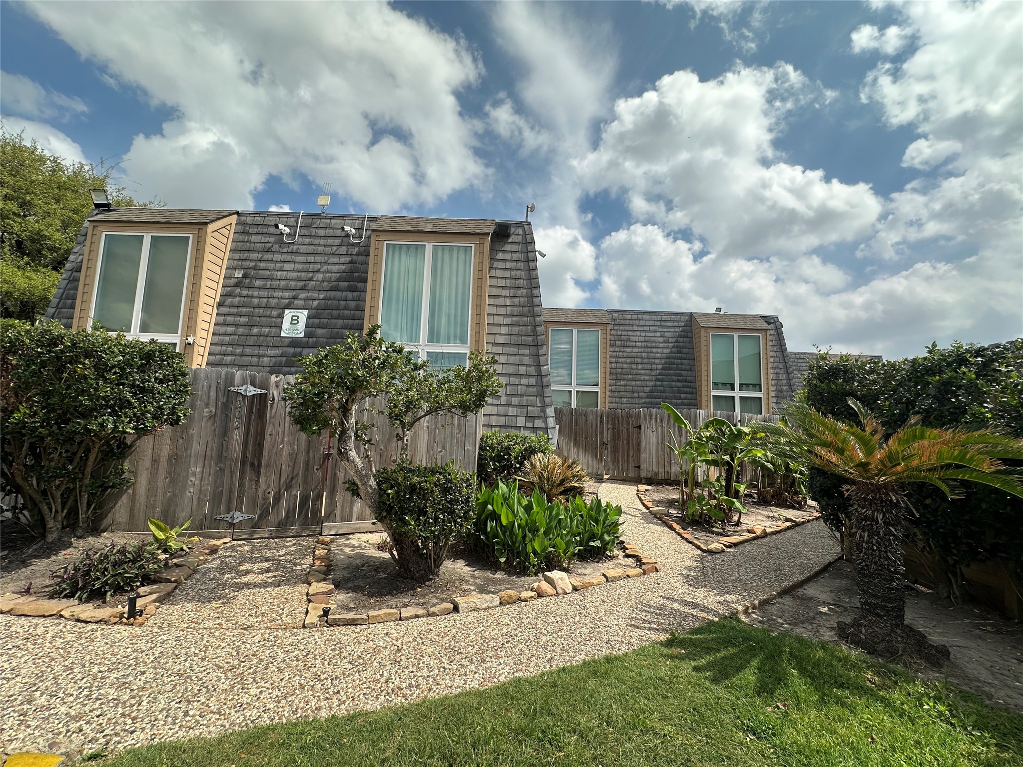16120 Stuebner Airline Road, Unit 202 Spring, TX 77379 - Photo 1 of 12 a view of a house with backyard and garden